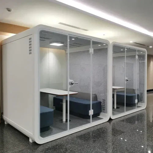 Soundproof office pods with glass doors, showcasing soundproofing vs sound absorbing for noise blocking and acoustic control.