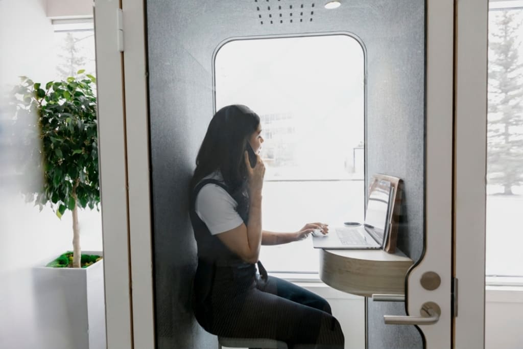 Woman-Using-Laptop-Office-Phone-Booth-1024x683px