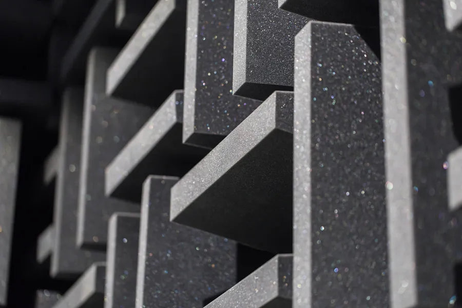 Close-up of acoustic foam with angular ridges, showcasing one of the best soundproofing materials for offices. 